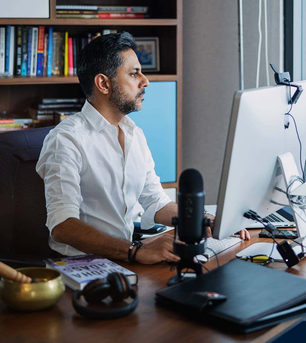 Vishen Lakhiani working in his office