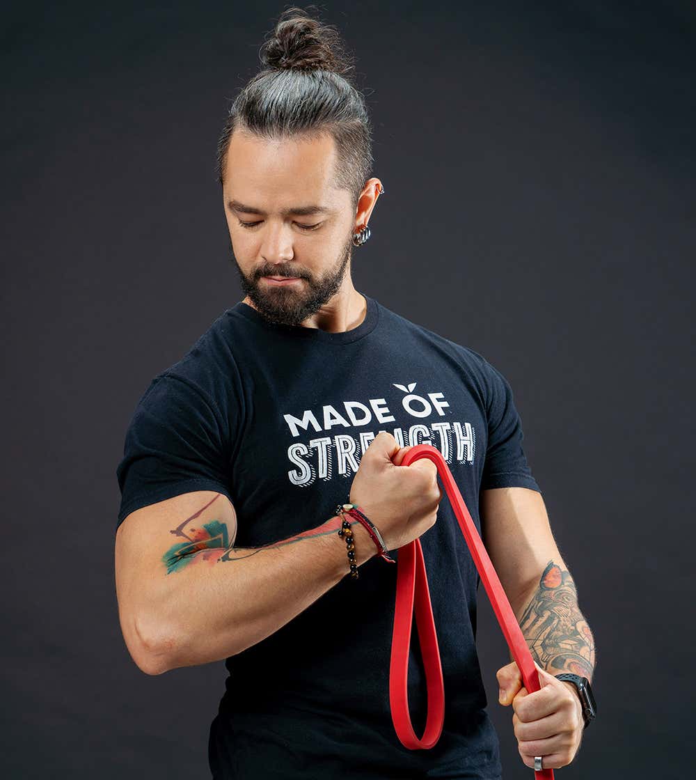 Portrait of Ronan holding a dumbbell
