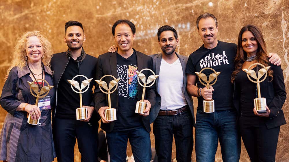 Vishen poses with a group of Mindvalley Trainers