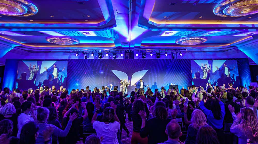 Lisa on stage at Mindvalley Reunion