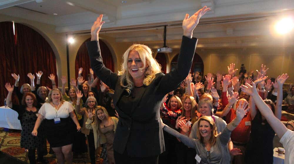 Christie Marie Sheldon teaching a large group of students