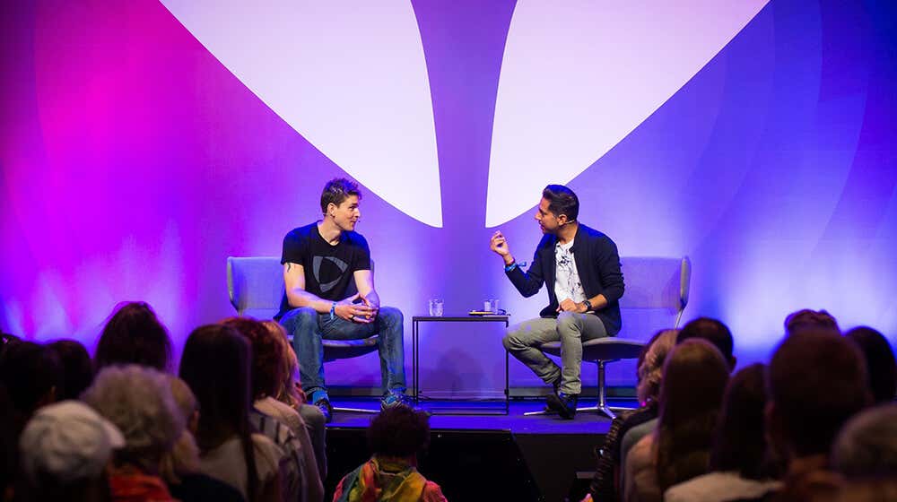 Ben Greenfield on stage with Vishen Lakhiani at Mindvalley U