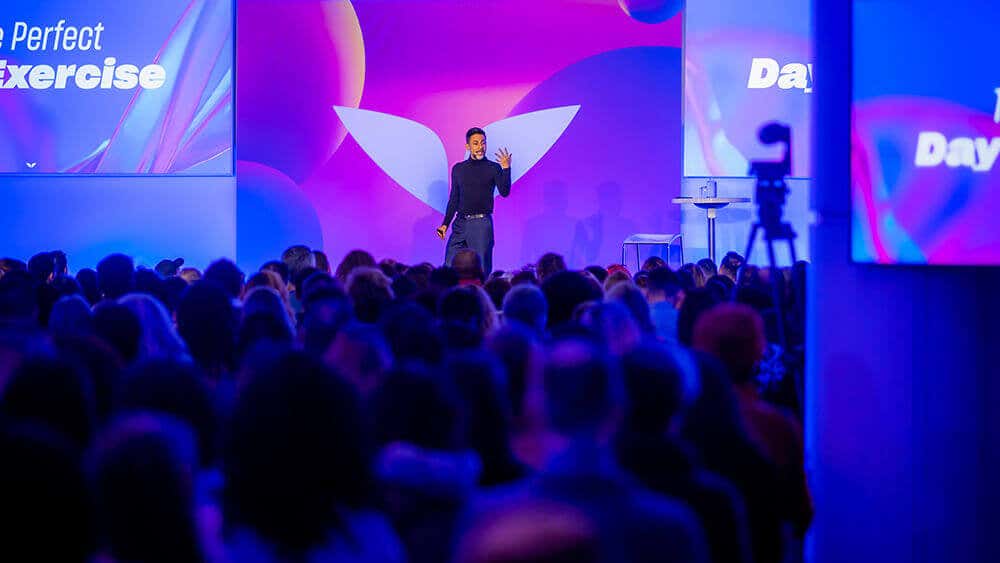 Vishen presenting on a stage