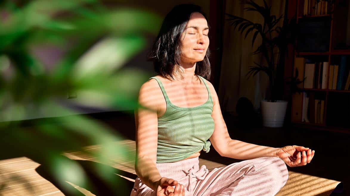 Mindvalley app on Apple TV, featuring Be Extraordinary, 10X Fitness, The Longevity Blueprint, The Mastery of Sleep, and many more programs.