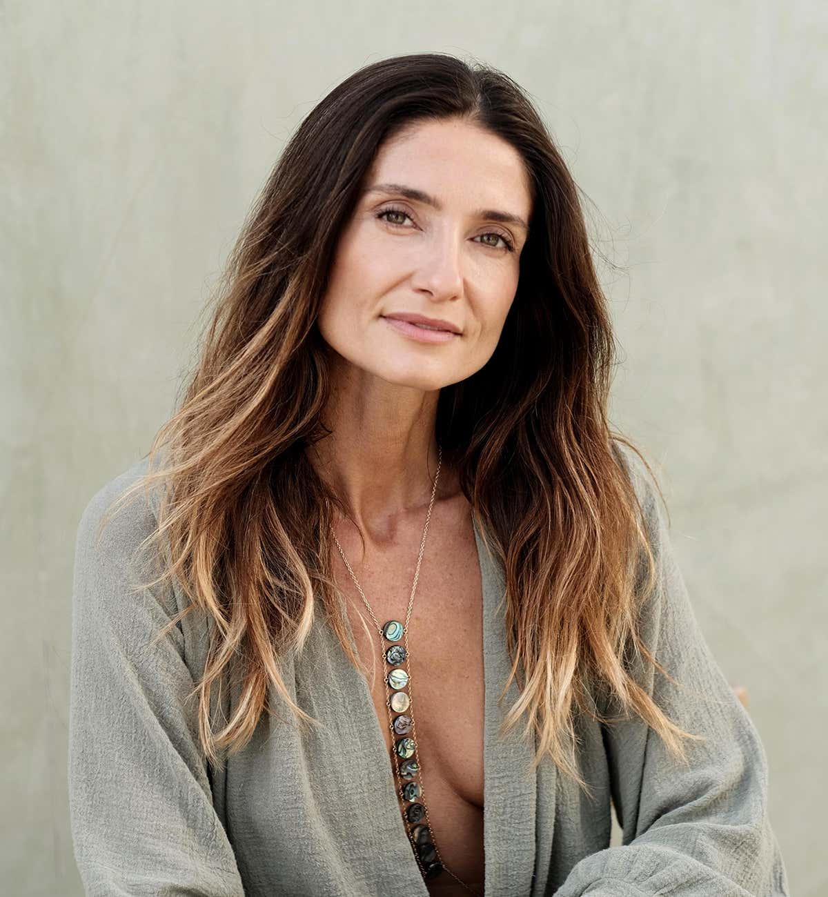 Bibi Brzozka wearing a gray robe