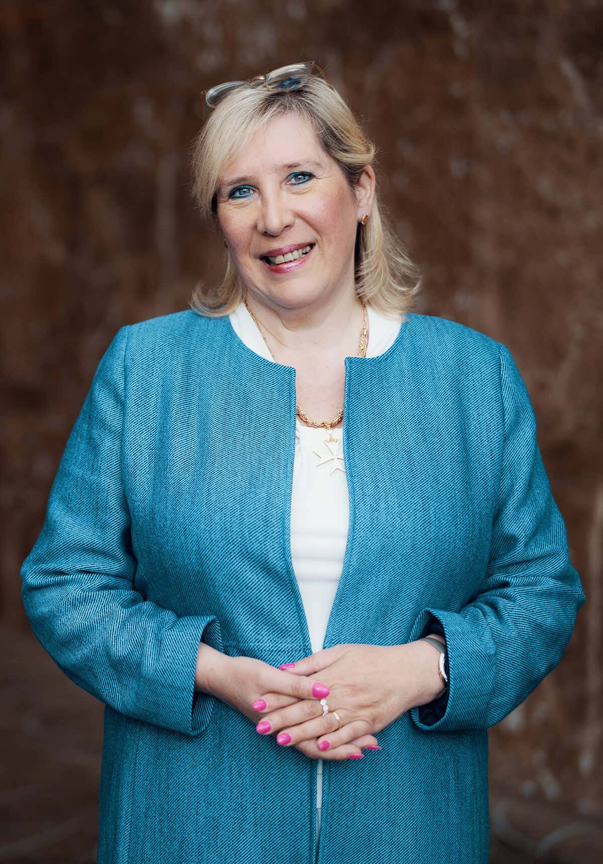 Marie Diamond wearing a blue coat