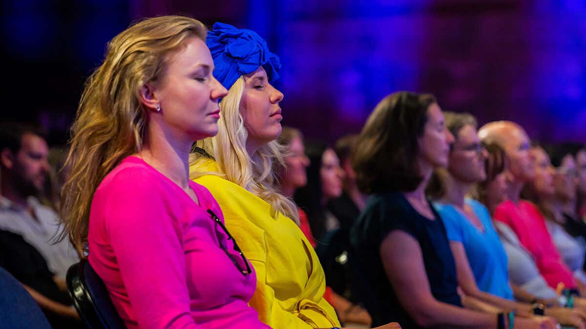 Mindvalley members meditating during a Mindvalley event