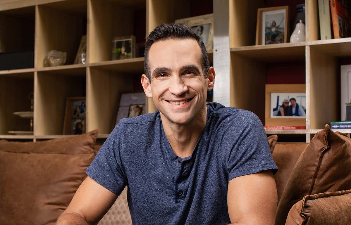 Nir Eyal, seated down and smiling.