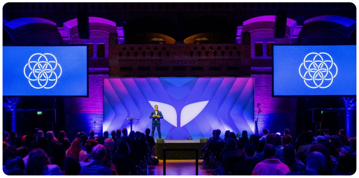 Oskar Pernefeldt, creator of the Earth flag on stage on Mindvalley U 2025