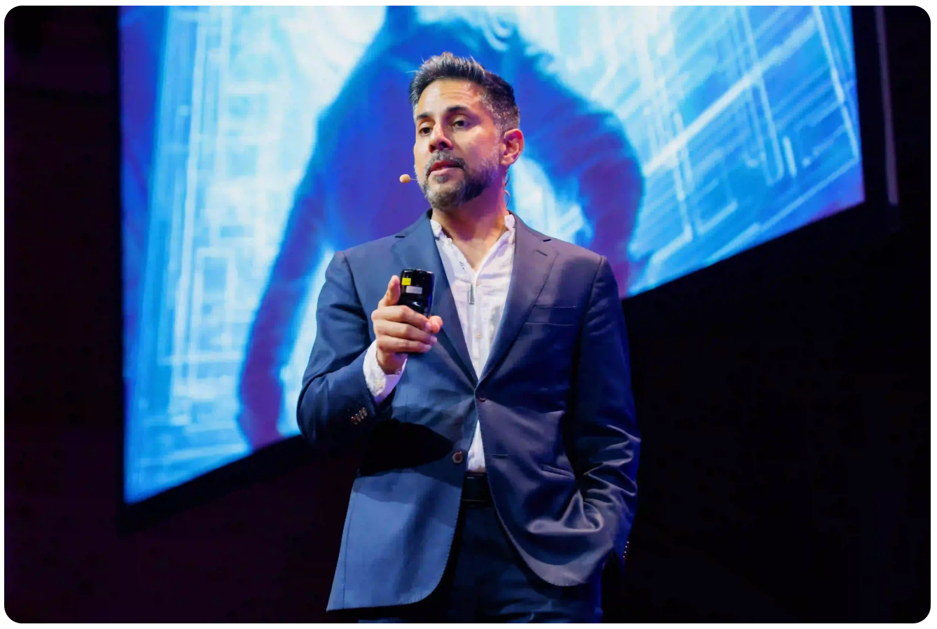 Vishen on stage speaking to entrepreneurs