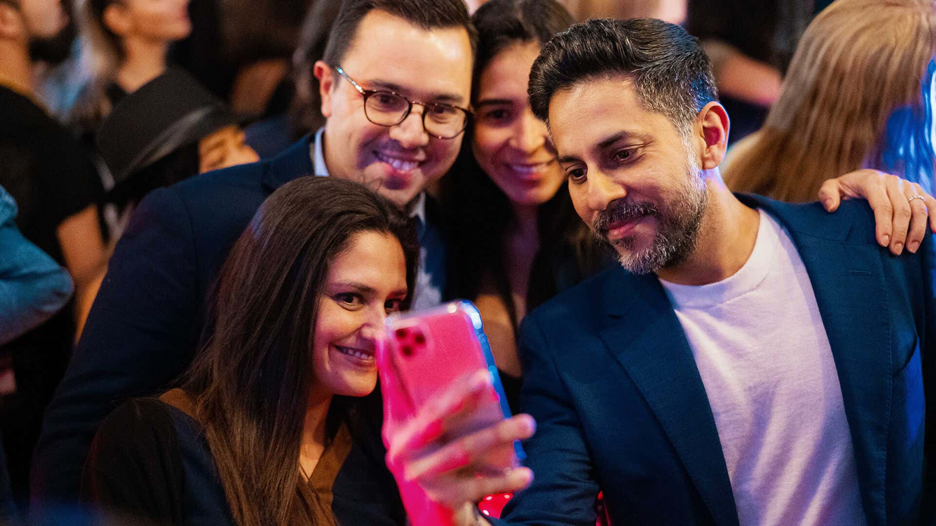 Vishen taking a selfie with attendees