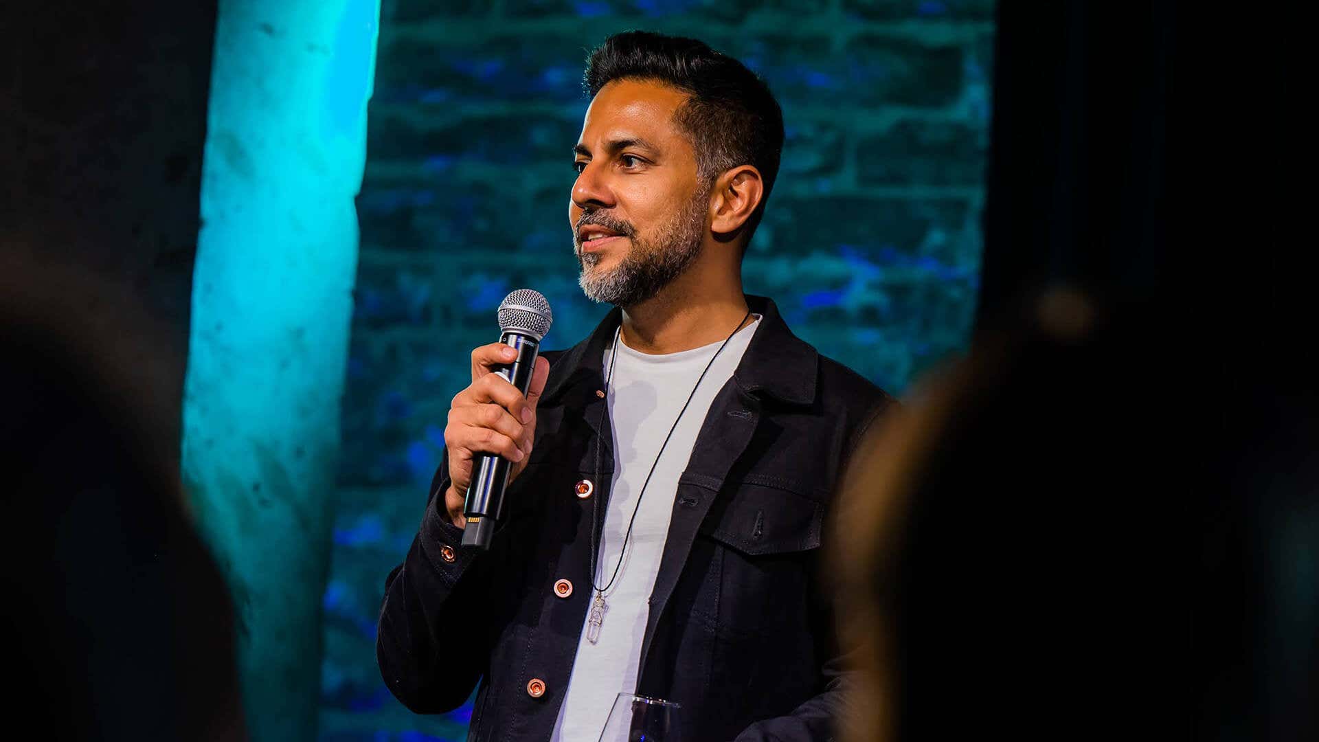 Vishen speaking on stage