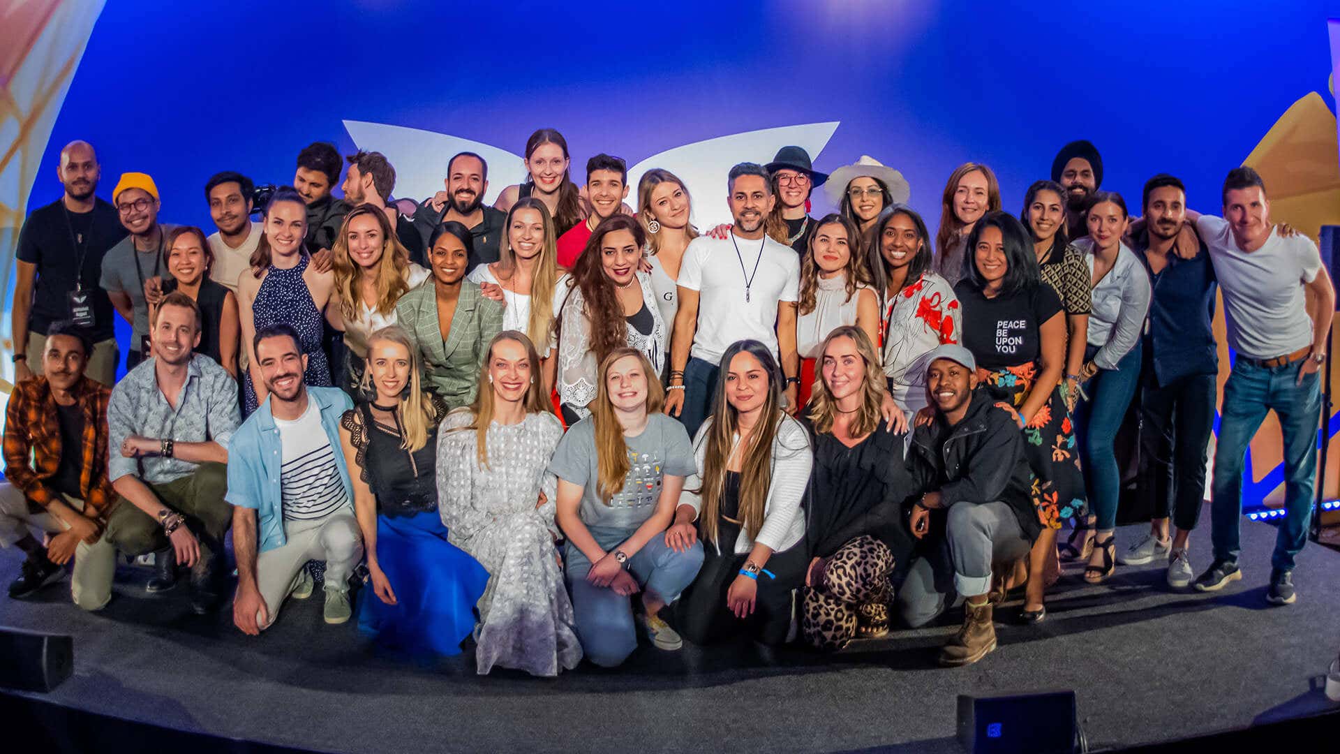 Group photo of the Mindvalley team at A-Fest