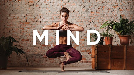 Category Mind - image of a woman doing a advanced yoga pose