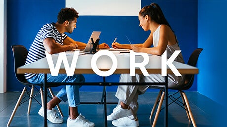 Category Work - young, happy couple sitting at a table with their laptop