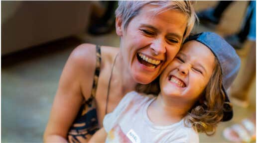 Parent and child laughing