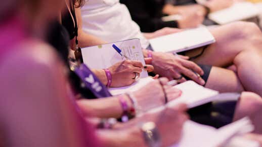 students taking notes of reflection during a seminar