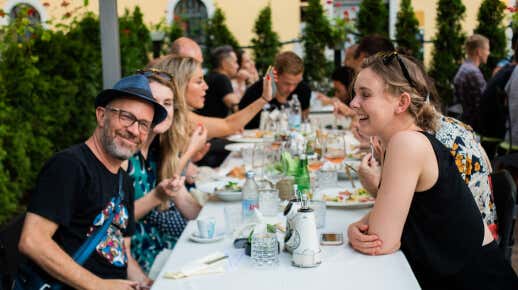 MVU students at outside dinner conversation