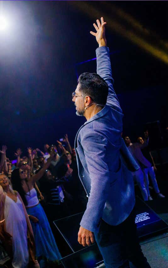Woman dancing on stage during a Mindvalley Event