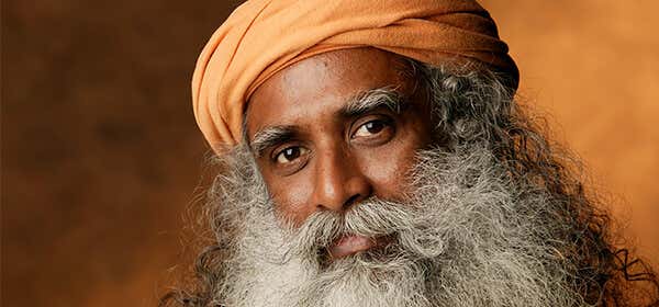 A headshot of Sadhguru with a sharp look