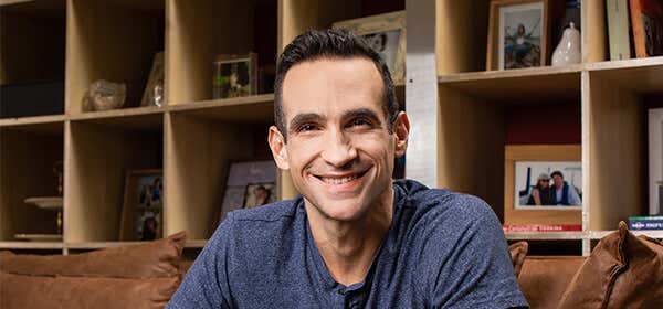 Nir Eyal, seated down and smiling.