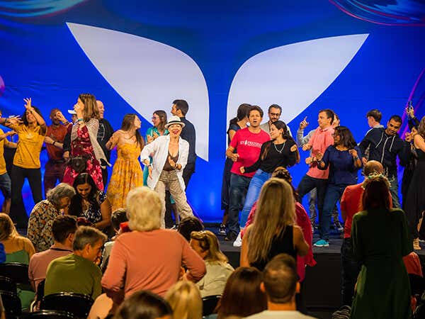 Happy customers dancing on stage