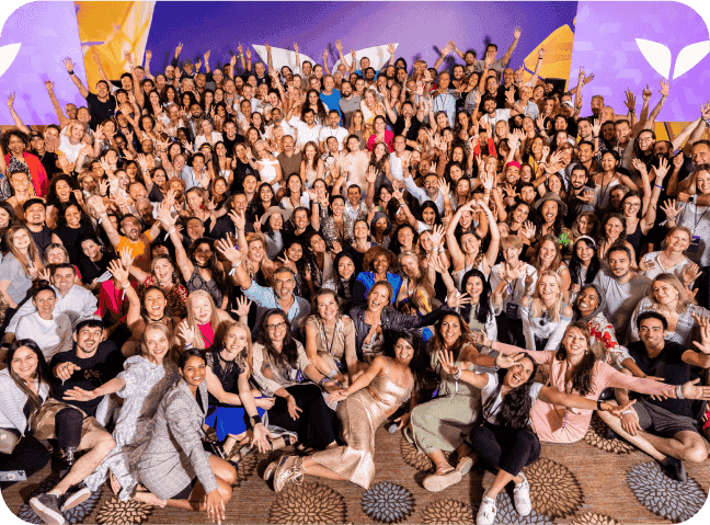 Group picture in Mindvalley A-Fest and app interface