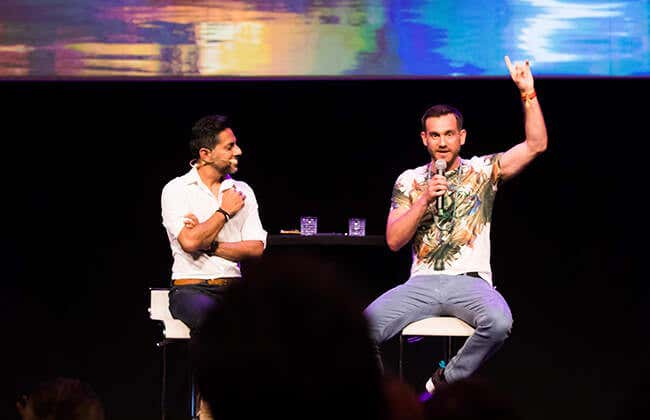 Vishen Lakhiani and Charlie Morley on stage at a Mindvalley event