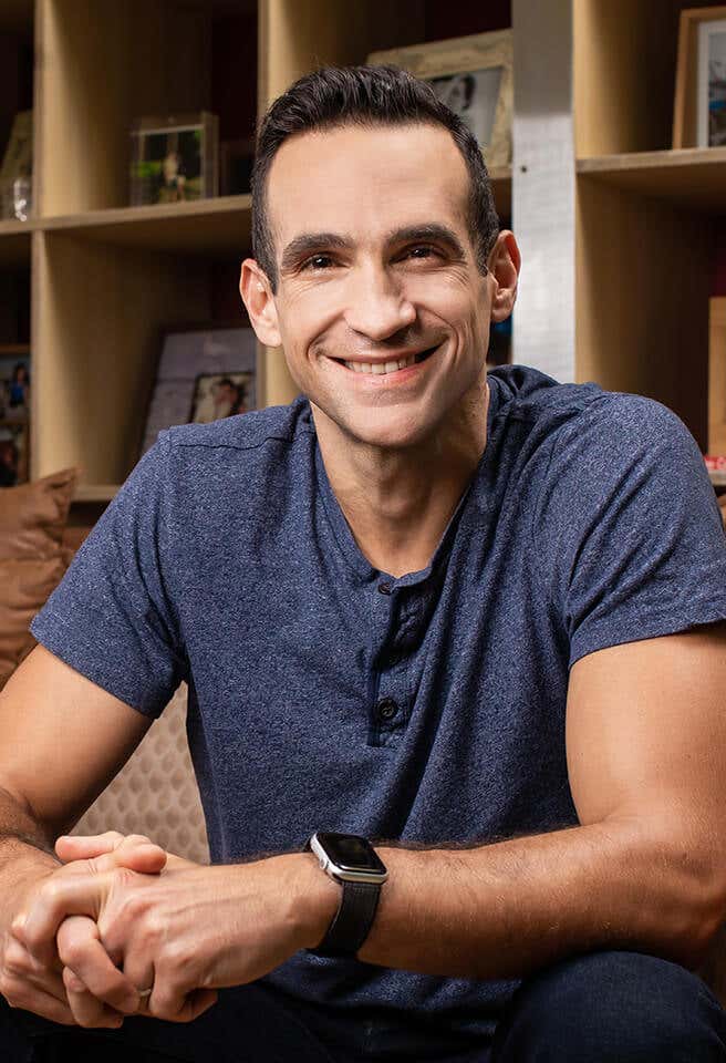 Nir Eyal, seated down and smiling.
