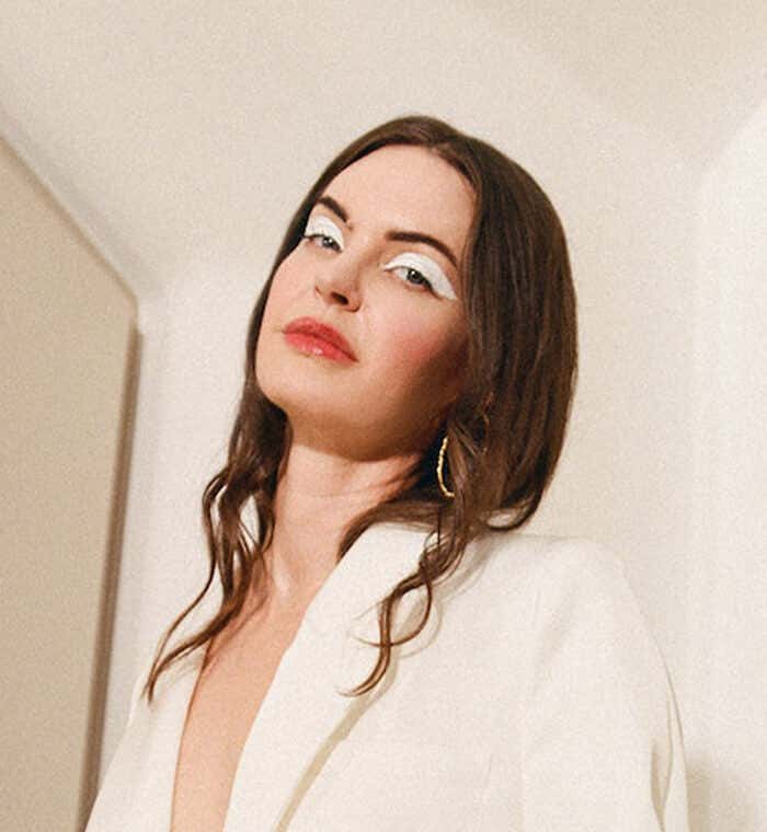 Layla wearing a beige blazer