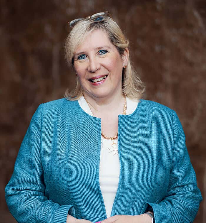 Marie Diamond wearing a blue coat