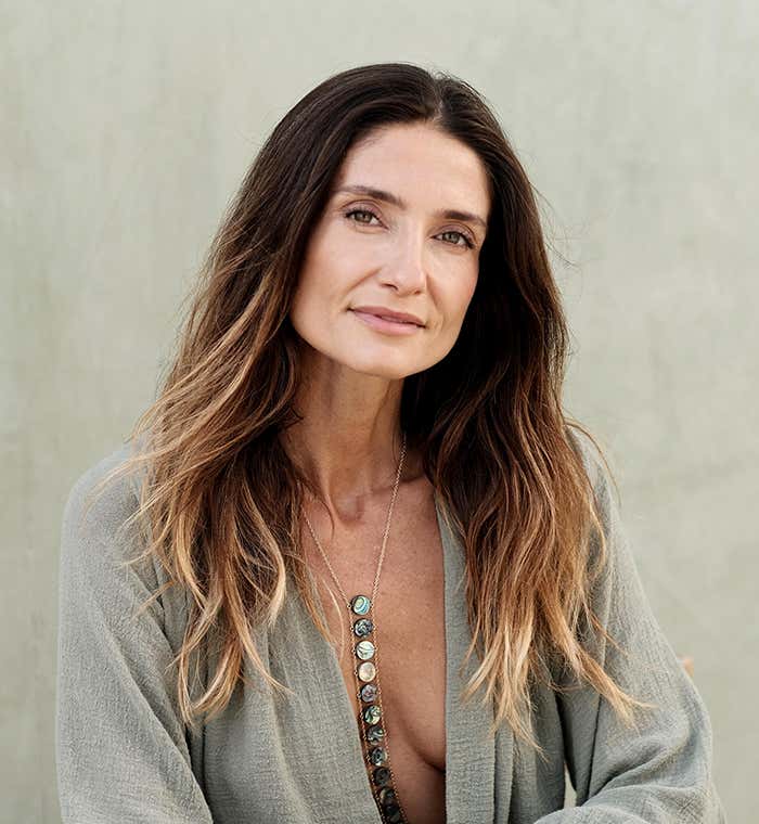 Bibi Brzozka wearing a gray robe