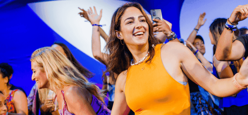 Portrait of MVU attendee celebrating on stage