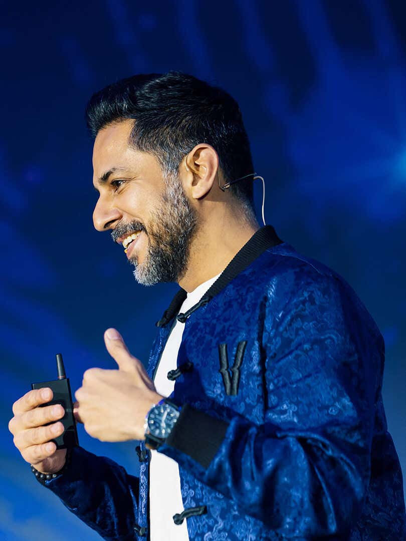 Close up of Vishen speaking on stage
