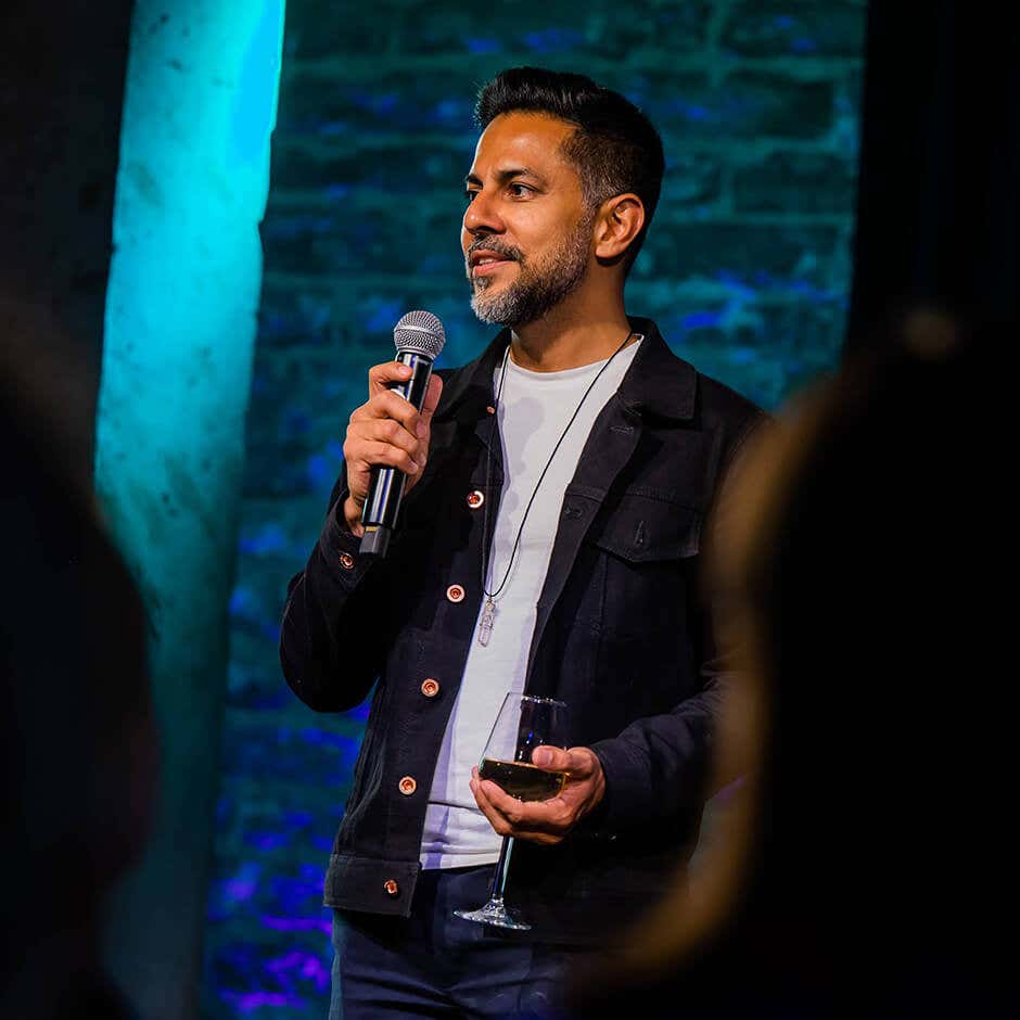 Vishen speaking in front of an audience